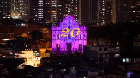 Reuters The number 20 is projected onto the ruins of St Paul