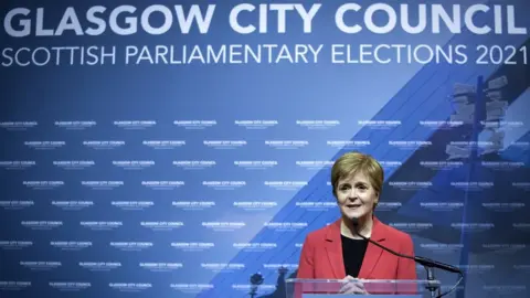 PA SNP leader Nicola Sturgeon visited the Emirates Arena in Glasgow wearing a bright red jacket on Friday