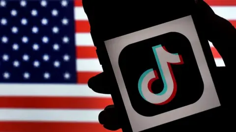 AFP An image of the tiktok logo and the American flag