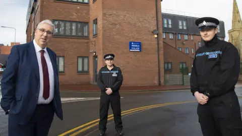 Mandy Jones PCC Arfon Jones with PC James Tapely, right, and Insp Iwan Jones