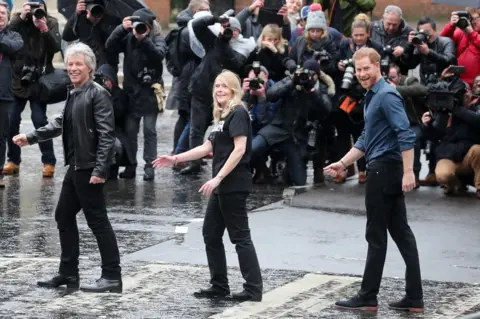 Chris Jackson / Getty Images The Duke of Sussex, singer Jon Bon Jovi and Invictus Games representatives are seen on the iconic Abbey road crossing