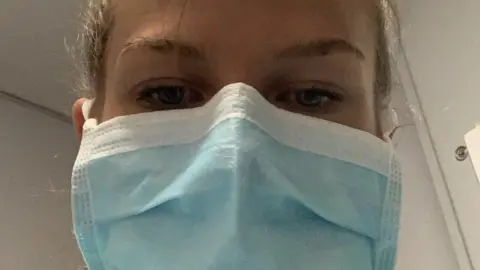 Leeoni Batty Leeoni Batty wearing a face mask