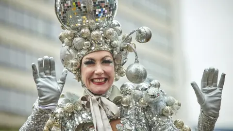 Manchester City Council woman covered in silver baubles