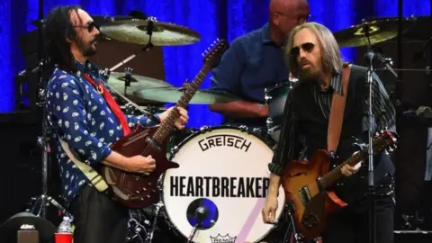 Getty Images Tom Petty (right) and The Heartbreakers perform in Nashville, Tennessee. Photo: April 2017