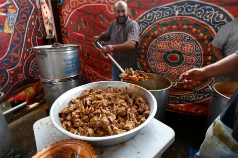 AFP A man prepares a traditional meal to be served during a wedding in Junzur, west of Tripoli, Libya October 31, 2018.