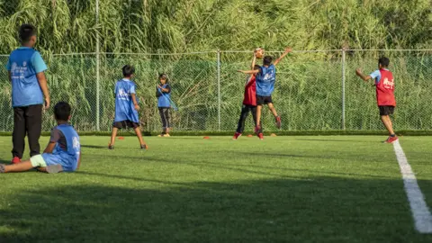 Frits Marchand Young refugees playing football in Lesbos