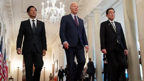 Getty Images Biden, Kishida and Marcos