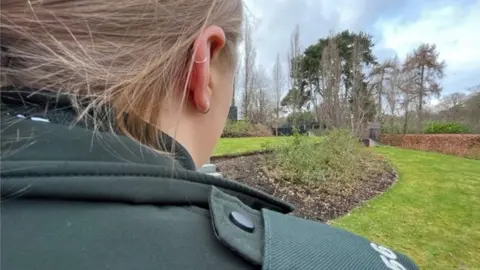 BBC female psni officer pictured from behind