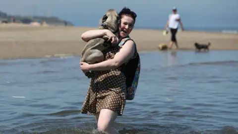 Andrew Milligan/PA Wire Ashley Arthur with Norman the puggle