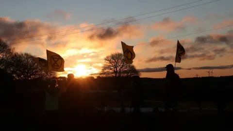 Reuters Protesters in front of sunrise