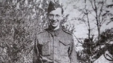 Handout Dennis Lanham in his military uniform in a black and white photograph