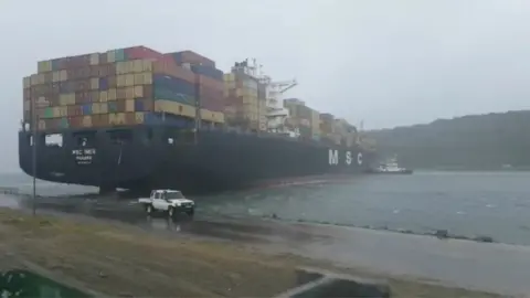 Blue Security via Reuters A container ship blocks the harbour mouth in Durban, South Africa, 10 October 2017