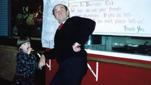 Mushing family photo Natalie Richards holding hands with her granddad Bob Mushing