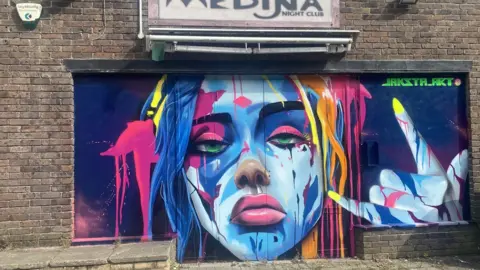 Swindon Paint Fest Mural of woman on a house