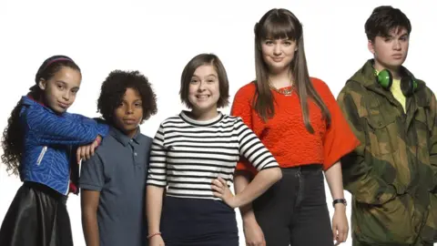 BBC/The Foundation/Graham Hunter Mya-Lecia Naylor with the cast of Millie Inbetween