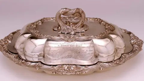 Charles Stuart Dudley Cole Silver entrée dish presented to Thomas Cole. Object lent by Charles Stuart Dudley Cole