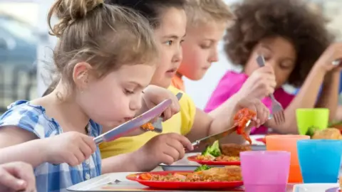 Getty Images Children eating lunch