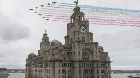 UK MOD Crown copyright 2017 The RAF Red Arrows flying past the Liver building in Liverpool