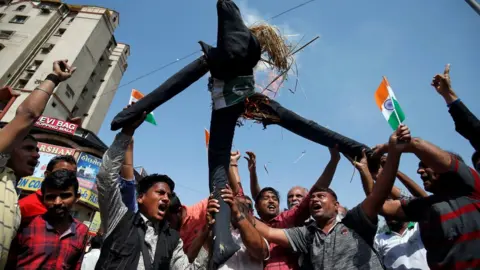 Reuters People burn an effigy depicting Pakistan as they celebrate after Indian authorities said their jets conducted airstrikes on militant camps in Pakistani territory, in Ahmedabad, India, February 26, 2019