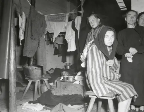 Alamy Women in Belsen hut