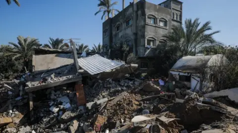 EPA The destroyed house of the Abu Naseir family in Gaza following an early Israeli air strike on 3 February