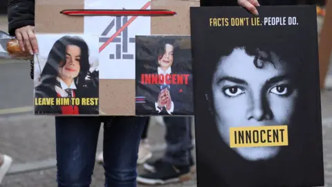 Getty Images Protest posters in support of Michael Jackson