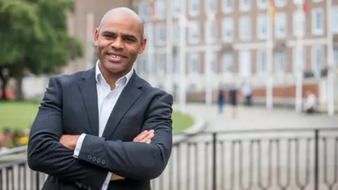 Bristol Live Bristol Mayor Marvin Rees posing with his arms folded outside City Hall