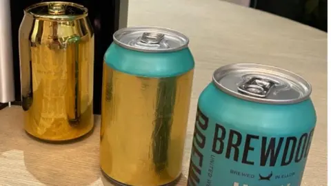 Adam Dean Brewdog gold cans