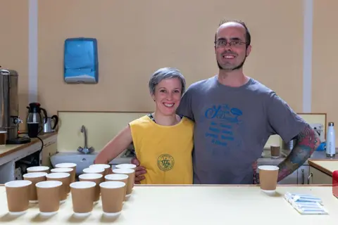 Jim Grover Matilda Smith and Sam Harris serving tea