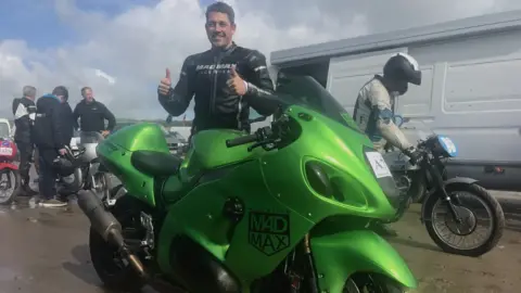 Zef Eisenberg Zef Eisenberg standing behind his bike