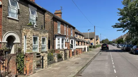 Ben Schofield/BBC Terraced homes in a Bedford street