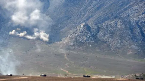 Kyrgyzstan presidency/Getty Images File picture of a military drill held in early April in the border region of Batken in Kyrgyzstan