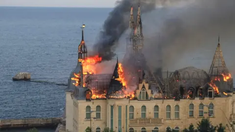 Flames rise from the domed 'Harry Potter castle' in Odesa