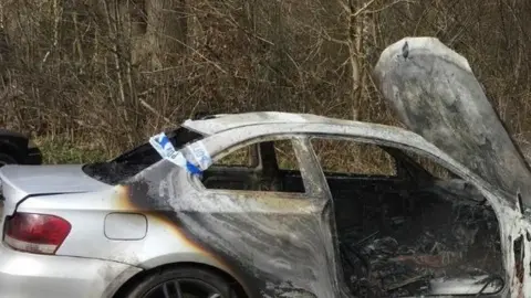 West Midlands Police A white one series BMW was found burnt out by the entrance to Crackley Woods on 22 March.