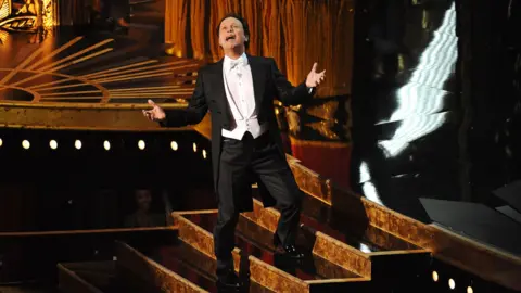 Getty Images Billy Crystal hosting the Oscars in 2012