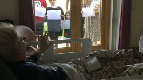 Family Kate Sloan's family reached out to her through glass on Mother's Day