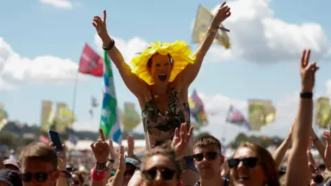 REUTERS/Jason Cairnduff A woman in the crowd at Glastonbury Festival
