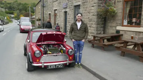 Tom Shorrock Tom with his modified 1987 Mini Mayfair.