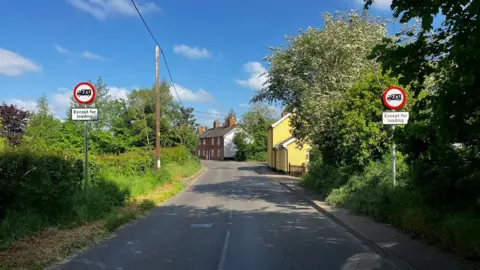 Matt Marvel/BBC The "except for loading" lorry signs on the way into Eye, Suffolk