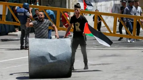 Reuters Palestinians demonstrating in the occupied West Bank