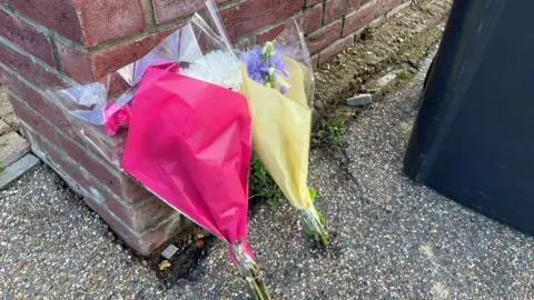 PA Media Floral tributes at The Row in Sutton