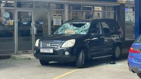 BBC A badly damaged car