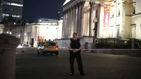 PA Media Officer standing watch at Trafalgar Square