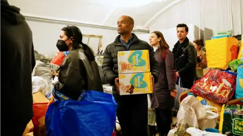 Reuters Volunteers with donations