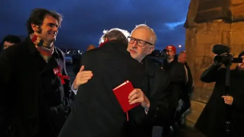 PA Media Richard Leonard hugging Jeremy Corbyn