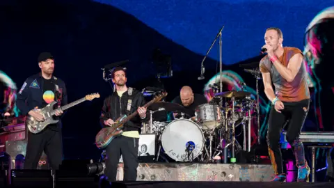 Getty Images Coldplay performing in Barcelona