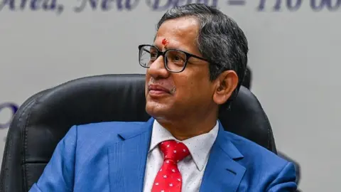 Getty Images Chief Justice of India NV Ramana listens to a speaker during his felicitation function in New Delhi on 4 September 2021.