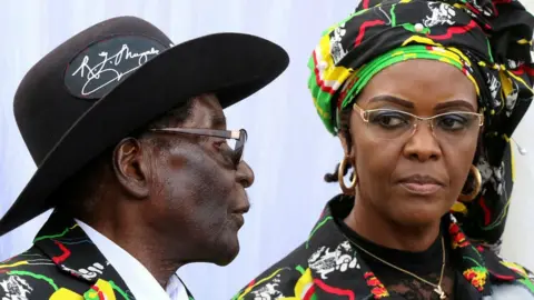 Reuters President Robert Mugabe and his wife Grace attend a Zanu-PF rally in Chinhoyi, Zimbabwe, July 29, 2017