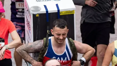 TOLGA AKMEN/EPA-EFE/REX/Shutterstock Sam Hammond at the 2023 London Marathon