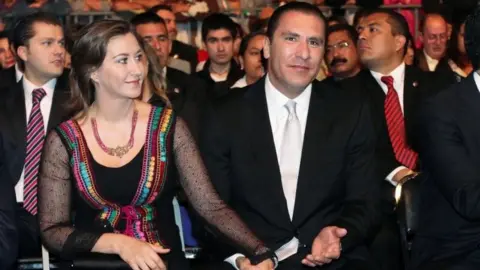 Reuters Martha Erika Alonso and Rafael Moreno Valle hold hands during an official ceremony in Puebla, Mexico. File photo